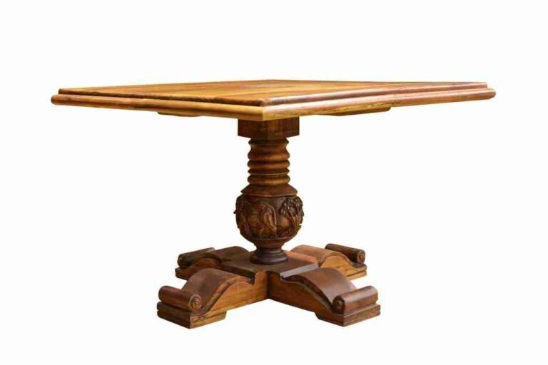 Rectangular wooden table with a carved central pedestal and four scroll-shaped feet