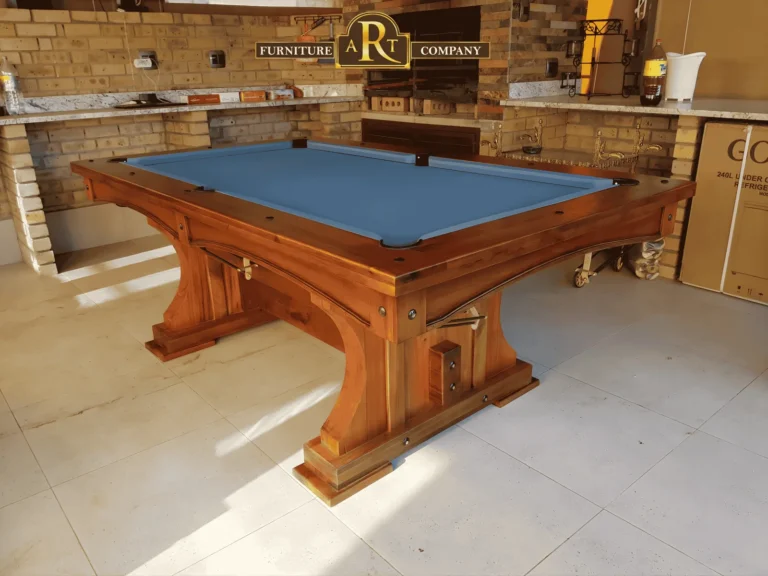 Wooden pool table with blue cloth and a substantial timber pedestal base
